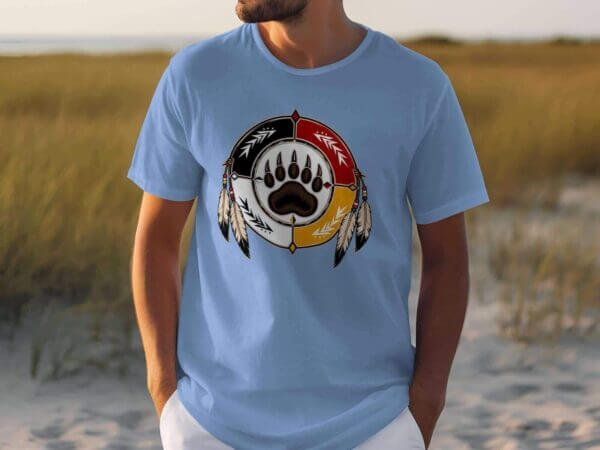 Light blue T-shirt with bear paw emblem