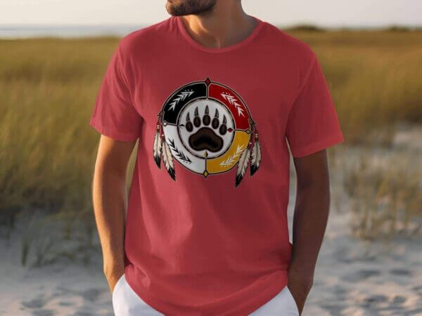 Man wearing red T-shirt with bear paw emblem